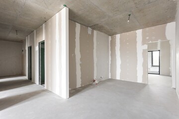 interior of the apartment without decoration in gray colors. rough finish