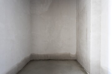 interior of the apartment without decoration in gray colors. rough finish