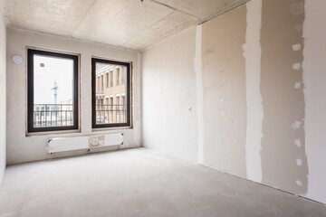interior of the apartment without decoration in gray colors. rough finish