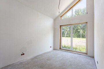 Fototapeta premium interior of the apartment without decoration in gray colors. rough finish