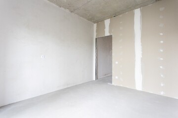 interior of the apartment without decoration in gray colors. rough finish