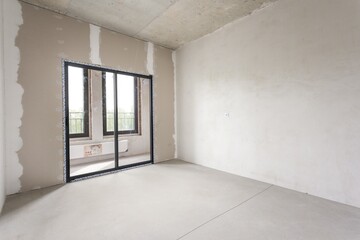 interior of the apartment without decoration in gray colors. rough finish