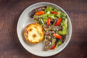 Quiche with lettuce and tomato salad. Healthy food.