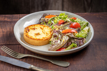 Quiche with lettuce and tomato salad. Healthy food.