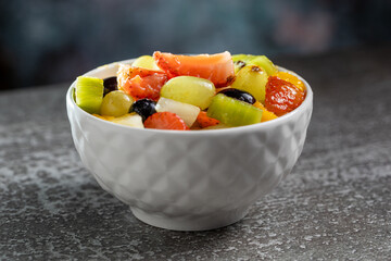 Healthy fresh fruit salad in bowl.
