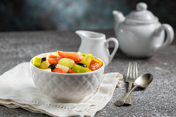 Healthy fresh fruit salad in bowl.