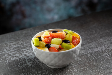 Healthy fresh fruit salad in bowl.