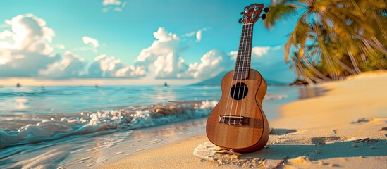 Copy space image of ukulele on a stunning summer beach scene