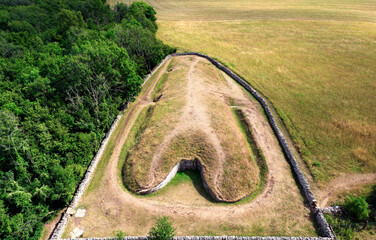 Belas Knap 5000 year Neolithic chambered long barrow near Winchcombe, UK. Cotswold Severn Cairn type. Showing burial chamber entrances and forecourt © David Matthew Lyons