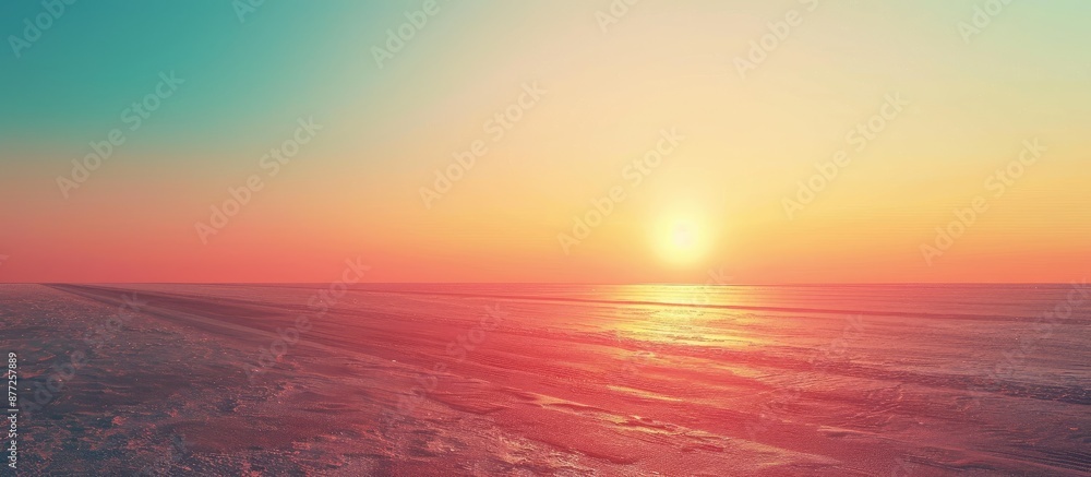 Aufkleber Sun rising on the skyline over an empty asphalt road with a colorful sunset painting the backdrop in a minimalist style design creating a nature background landscape with ample copy space for an image