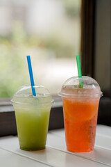 two cocktails with ice on the table. nonalcoholic drinks