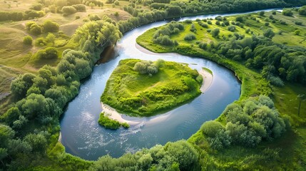 A high definition drone of a meandering river with sandy banks, surrounded by greenery and scattered trees. The scene captures the serene beauty of the natural environment.