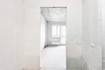 interior of the apartment without decoration in gray colors. rough finish