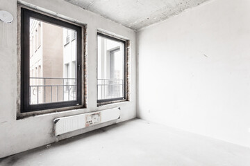 interior of the apartment without decoration in gray colors. rough finish