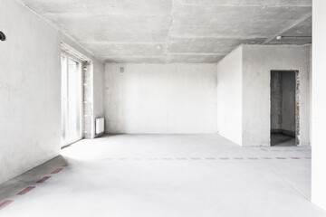 interior of the apartment without decoration in gray colors. rough finish