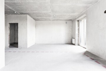 interior of the apartment without decoration in gray colors. rough finish