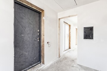 interior of the apartment without decoration in gray colors. rough finish