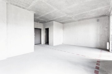 interior of the apartment without decoration in gray colors. rough finish