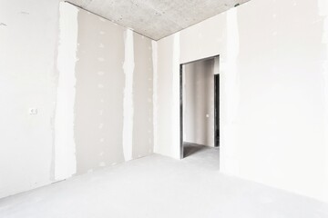 interior of the apartment without decoration in gray colors. rough finish