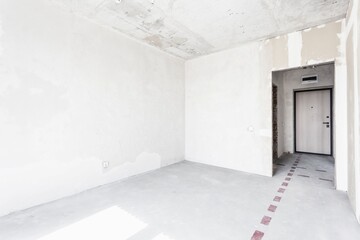 interior of the apartment without decoration in gray colors. rough finish