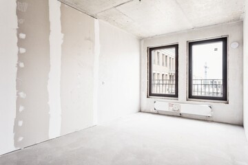 interior of the apartment without decoration in gray colors. rough finish
