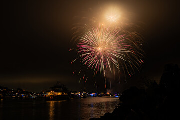 Fototapeta premium Bight colorful fireworks burst over Marina del Rey for LA County's Fourth of July Celebration.