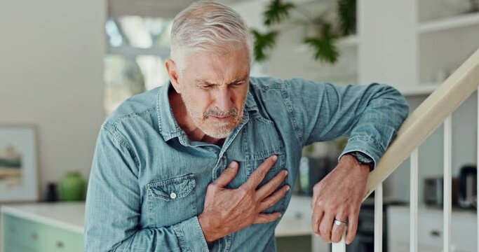 Chest pain, heart attack and senior man in home for medical emergency, crisis and accident. Hypertension, healthcare and mature person with discomfort, breathing problem and injury for stroke risk