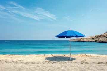 Fototapeta premium Malta Beach. Beautiful Bay with Blue Umbrella on Deserted Tropical Coastline