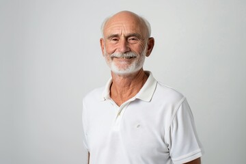 Obraz premium Portrait of a glad caucasian man in his 50s wearing a breathable golf polo isolated on plain white digital canvas
