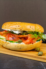 smoked salmon bagel, with all the trimmings, portrait