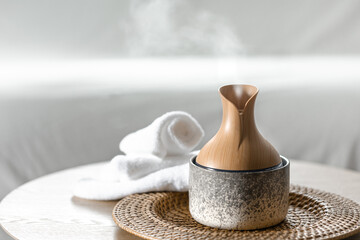 Essential oil aroma diffuser humidifier diffusing water in the air.