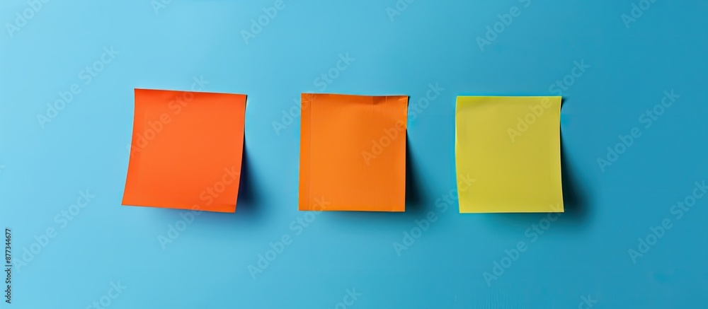 Poster three vibrant orange sticky notes against a blue backdrop with room for text using stationary design