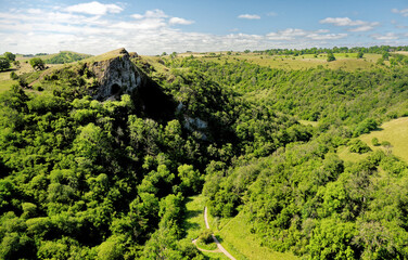 Obraz premium Thors Cave natural cavern in Manifold Valley, Staffordshire, England. Early human habitation and burial dates from late Palaeolithic 12,000 years ago