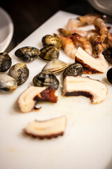 Fototapeta premium Traditional seafood mussels in wine sauce and herbs. Top view