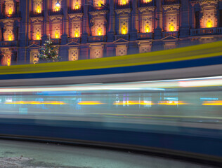 Tram at Night in Bahnhofstrasse and Illuminated Building in Long Exposure in a Winter Night in City of Zurich, Switzerland.