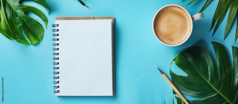Poster top view flat lay of a blank notepad with ample copy space image