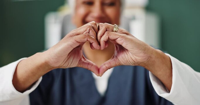 Woman, doctor and hand shape for heart with healthcare trust, empathy and support in clinic. Female person, medical expert and love emoji or sign for kindness, wellness and review for cardiology