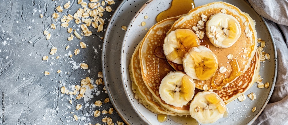 Aufkleber a top view photograph featuring a breakfast spread of fluffy pancakes topped with sliced bananas dri