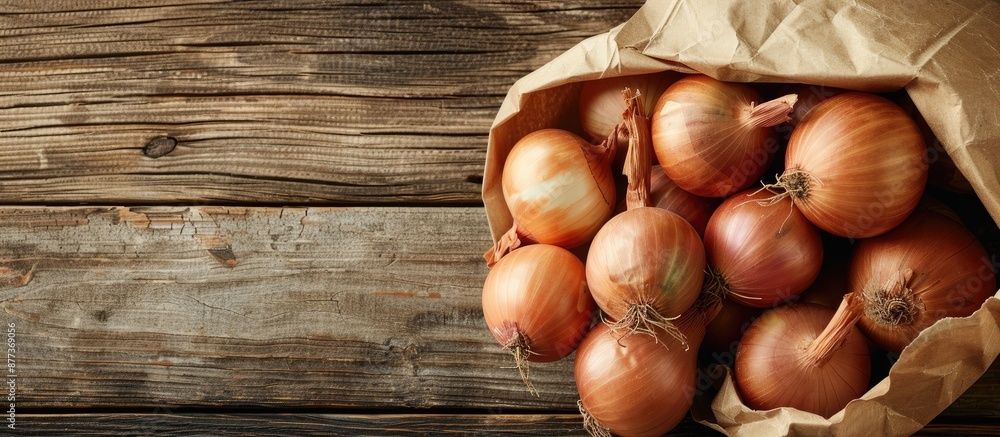 Poster organic onions in a paper bag on a wooden background with selective focus and top view for a bio pro