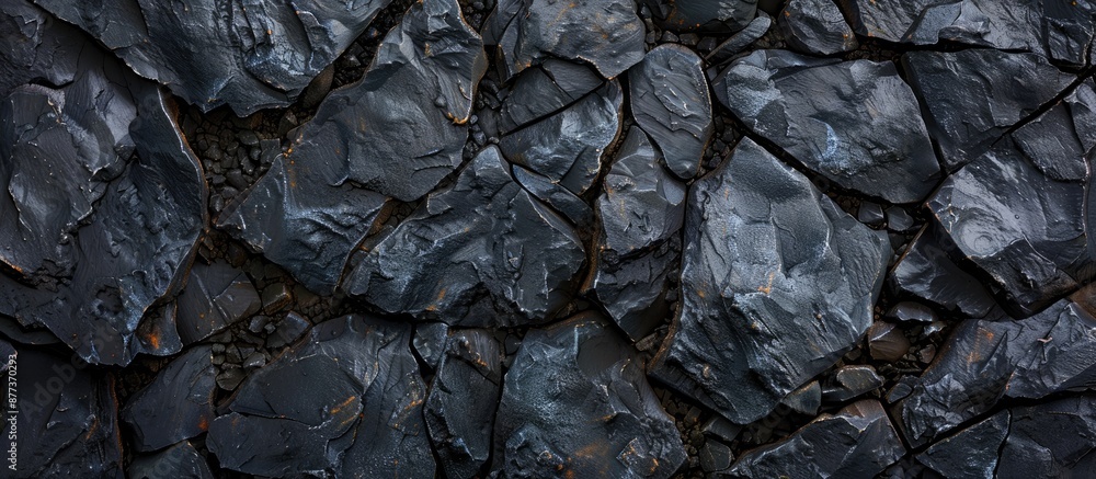Poster stone background with black texture resembling mountain rocks creating an abstract copy space image 