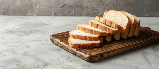 Arrange sliced bread on a wooden cutting board with room for a design in a copy space image