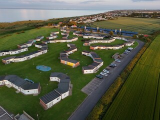 Winterton chalets park Norfolk UK Overhead birds eye drone aerial view  .