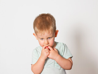 Emotional child on a light background