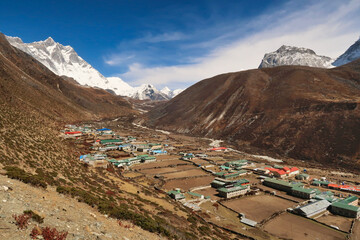View onto Dingboche village, Mount Lhotse and Island peak can be seen in the background at the end...
