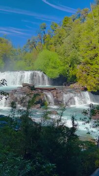 Beautiful light blue paradisiacal waterfalls located in the Huilo Huilo reserves