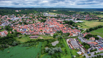 Aerial panorama view around the old town of Scheinfeld on an overcast summer day in Germany.