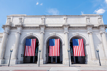train station with American flags in Washington DC, Union Station, vertical