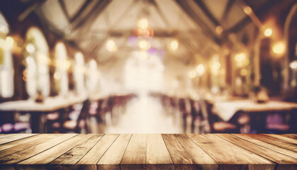 empty wood table top on blur light gold bokeh of cafe restaurant in dark background