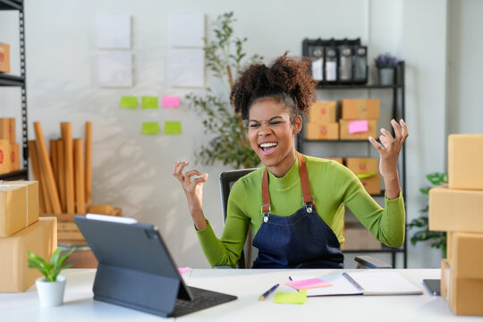 Female entrepreneur in her early twenties is struggling with stress and feeling overwhelmed by the workload at her startup