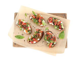 Delicious ricotta bruschettas with tomatoes, arugula and basil isolated on white, top view